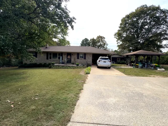 a view of a backyard with sitting area