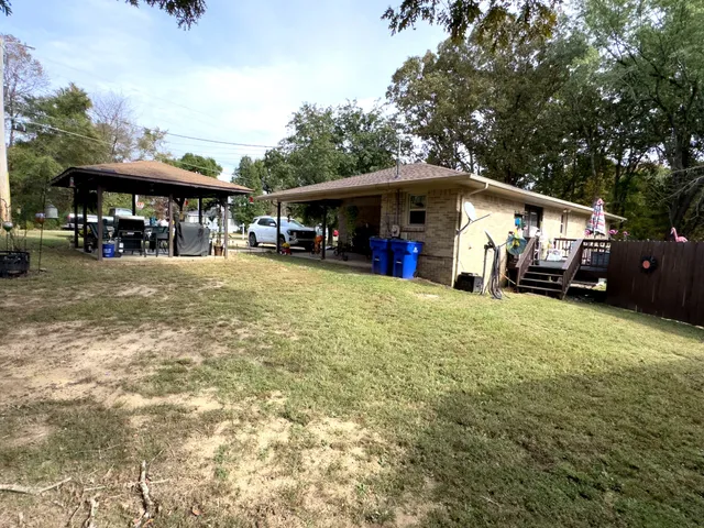 a room with wooden furniture and a table