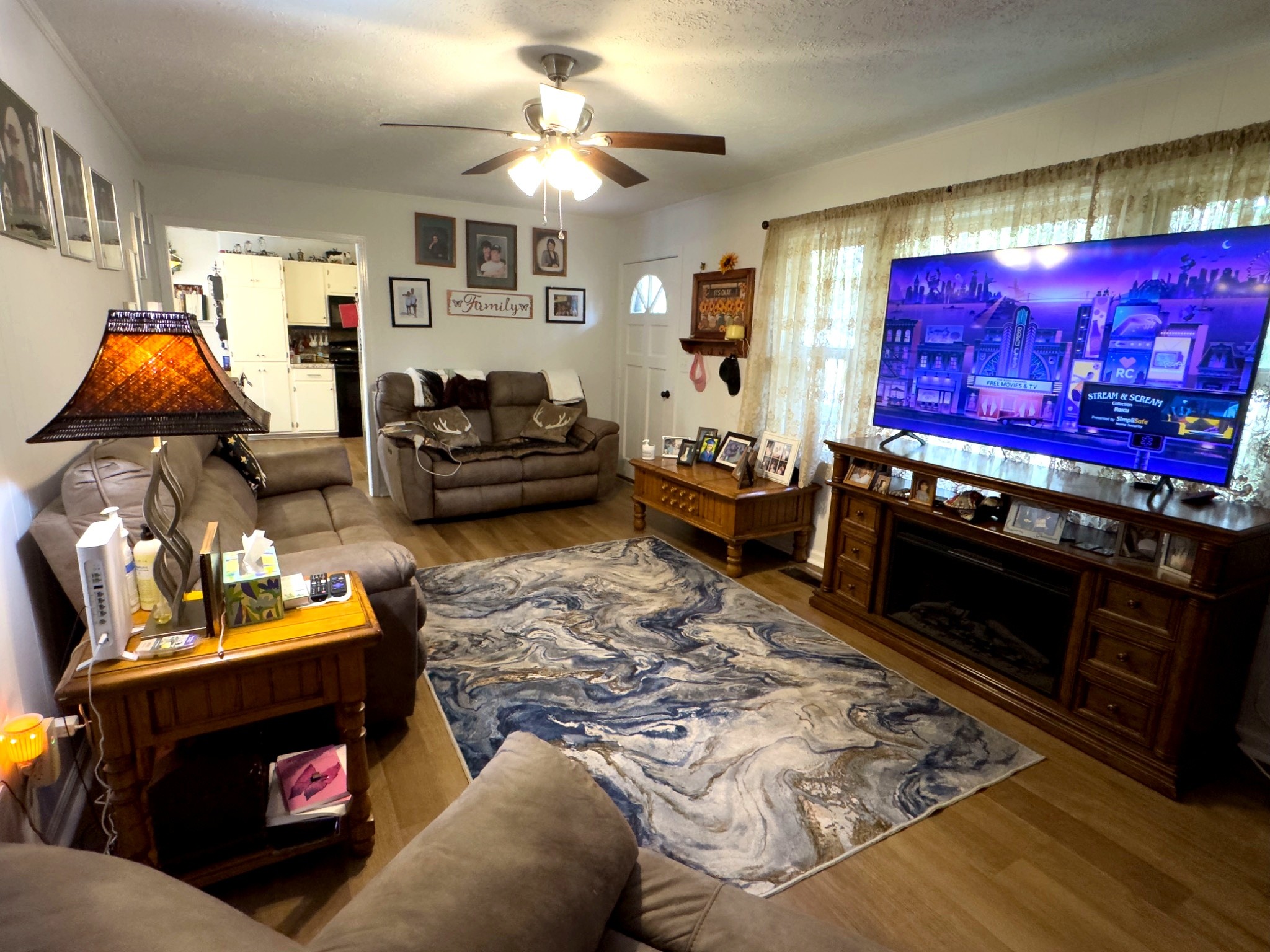 1344 Railroad Bed Road Collinwood, TN 38450 - Photo 8 of 40 a living room with furniture a rug and a fireplace