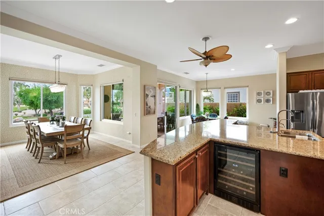 a dining room with furniture window and wooden floor