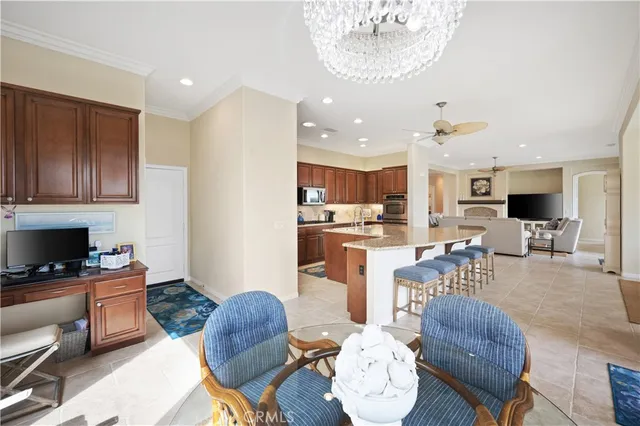 a kitchen with stainless steel appliances granite countertop a sink a stove and refrigerator