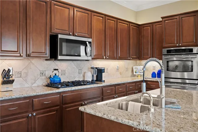 a bedroom with a bed couch and a window