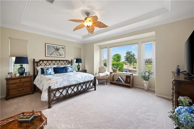 a large white kitchen with a large window