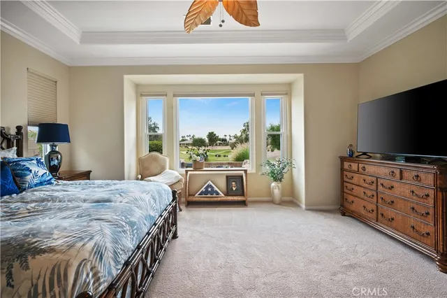 a spacious bathroom with a tub sink and mirror
