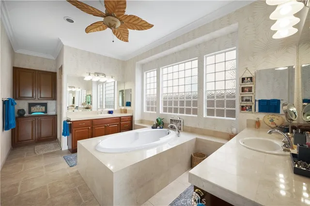 a large white kitchen with a large window