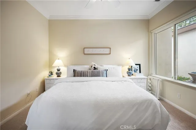 a view of a house with swimming pool and sitting area