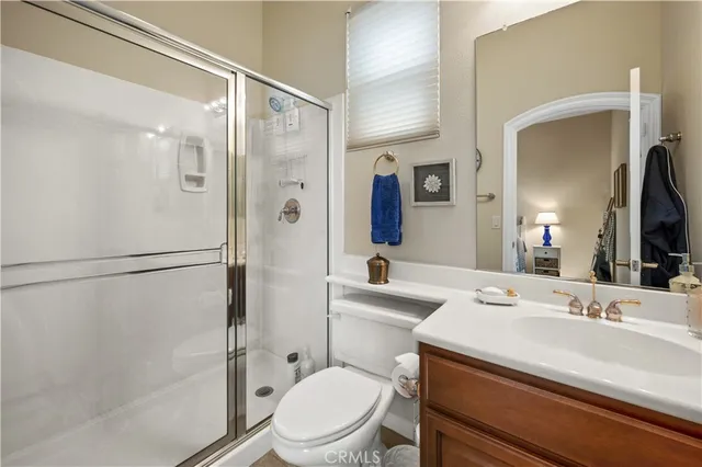 a room with furniture pool table and a flat screen tv