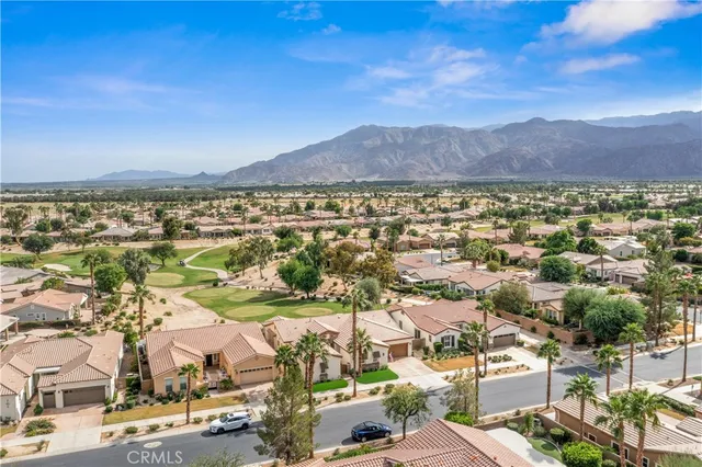an aerial view of residential houses and outdoor space