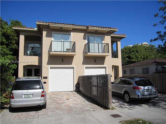 a view of a car park in front of house