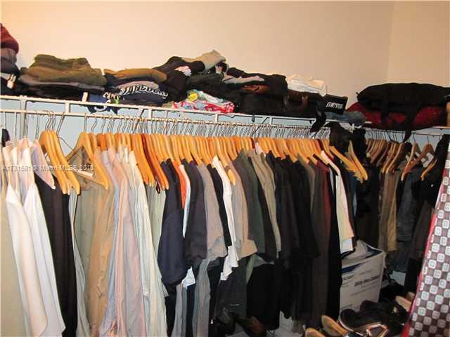 3749 Southwest 27th Lane, Unit 3749 Miami, FL 33134 - Photo 11 of 16 a view of walk in closet with clothes and shoes