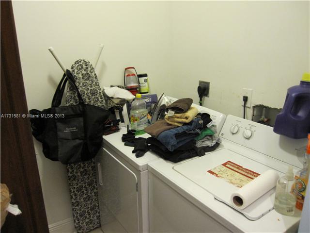 3749 Southwest 27th Lane, Unit 3749 Miami, FL 33134 - Photo 14 of 16 a living room with furniture and a wooden floor