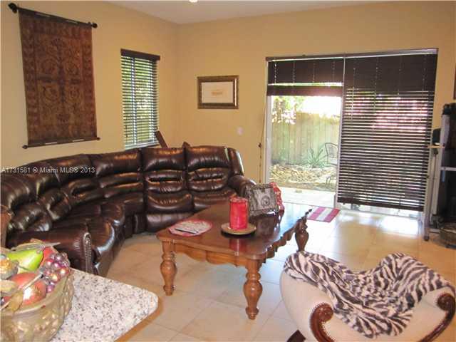 3749 Southwest 27th Lane, Unit 3749 Miami, FL 33134 - Photo 2 of 16 a room with furniture and a window