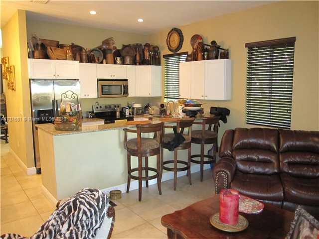 3749 Southwest 27th Lane, Unit 3749 Miami, FL 33134 - Photo 3 of 16 a living room with furniture