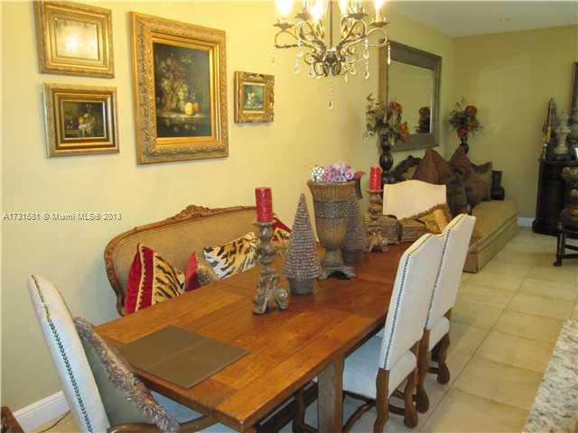 3749 Southwest 27th Lane, Unit 3749 Miami, FL 33134 - Photo 4 of 16 a view of a dining room with furniture