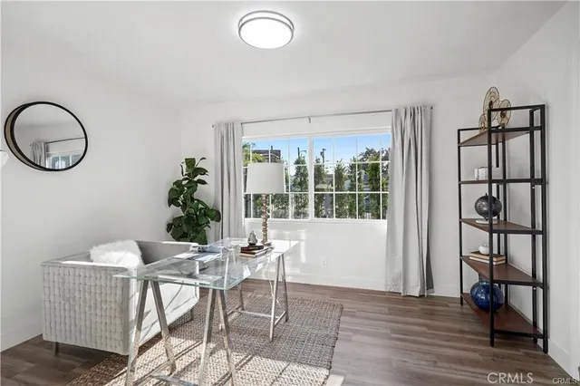 a view of a livingroom with furniture and window