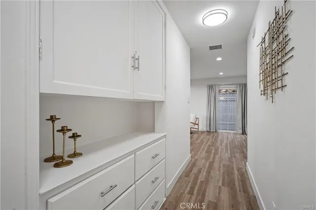 a view of a kitchen with cabinets