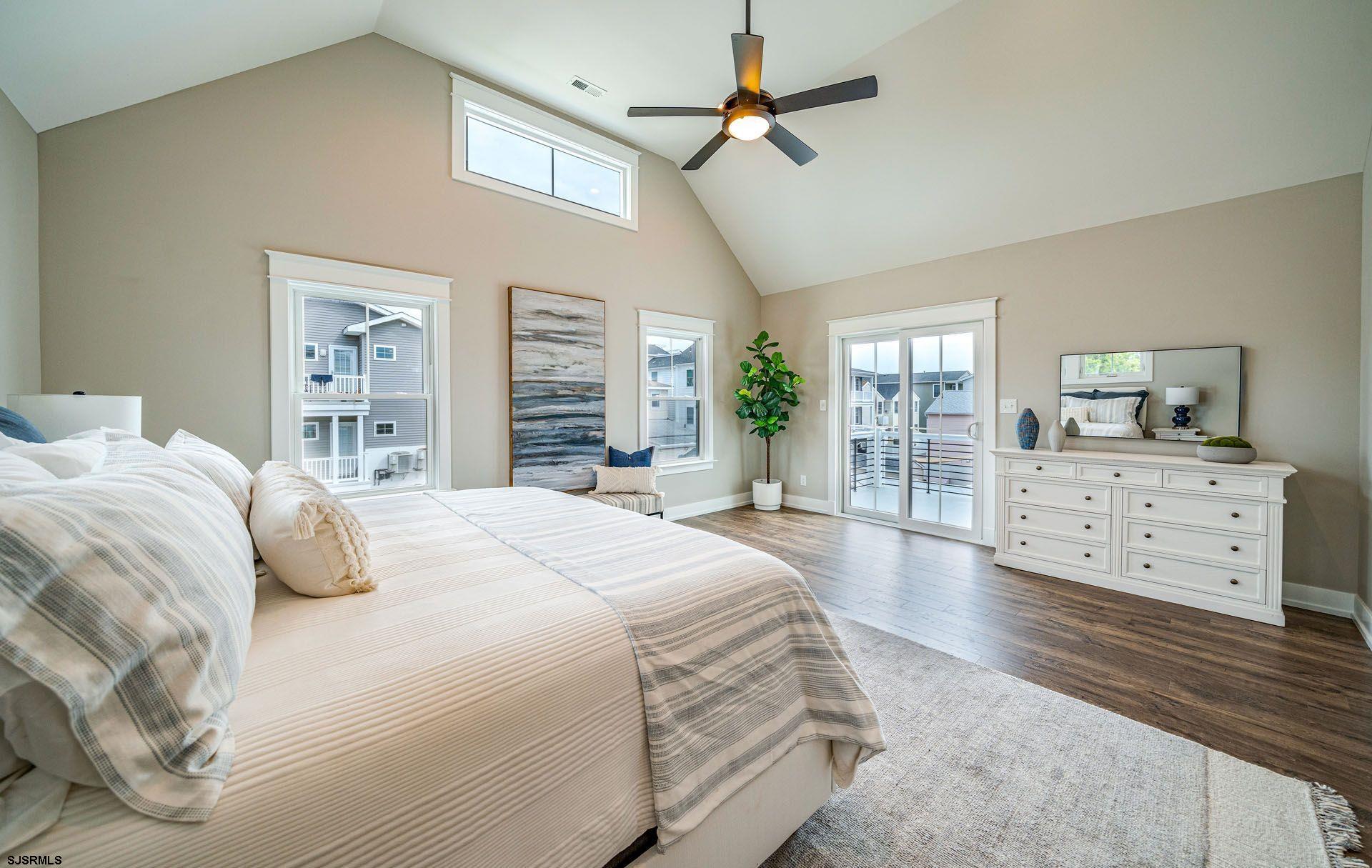 4 Wesley Road Ocean City, NJ 08226 - Photo 11 of 44 a bedroom with a large bed and a view of bedroom
