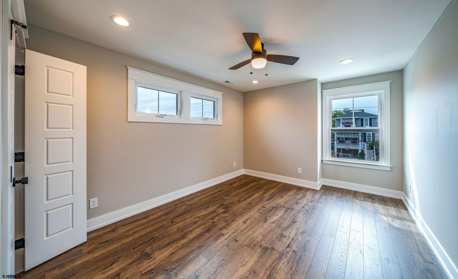 4 Wesley Road Ocean City, NJ 08226 - Photo 13 of 44 a view of empty room with wooden floor and fan