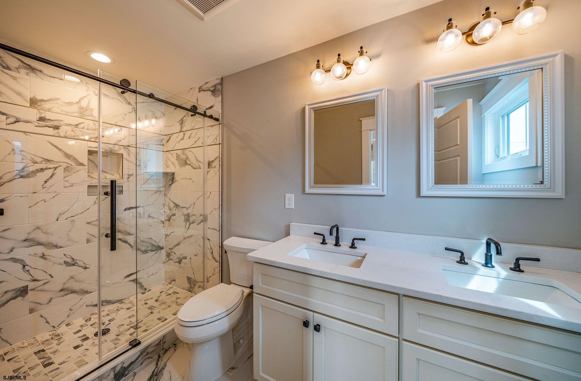 4 Wesley Road Ocean City, NJ 08226 - Photo 14 of 44 a bathroom with a sink toilet and shower