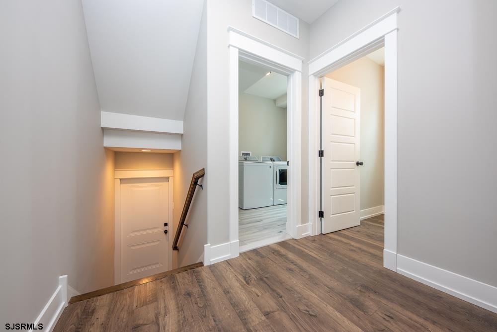 4 Wesley Road Ocean City, NJ 08226 - Photo 17 of 44 an empty room with wooden floor and a bathroom