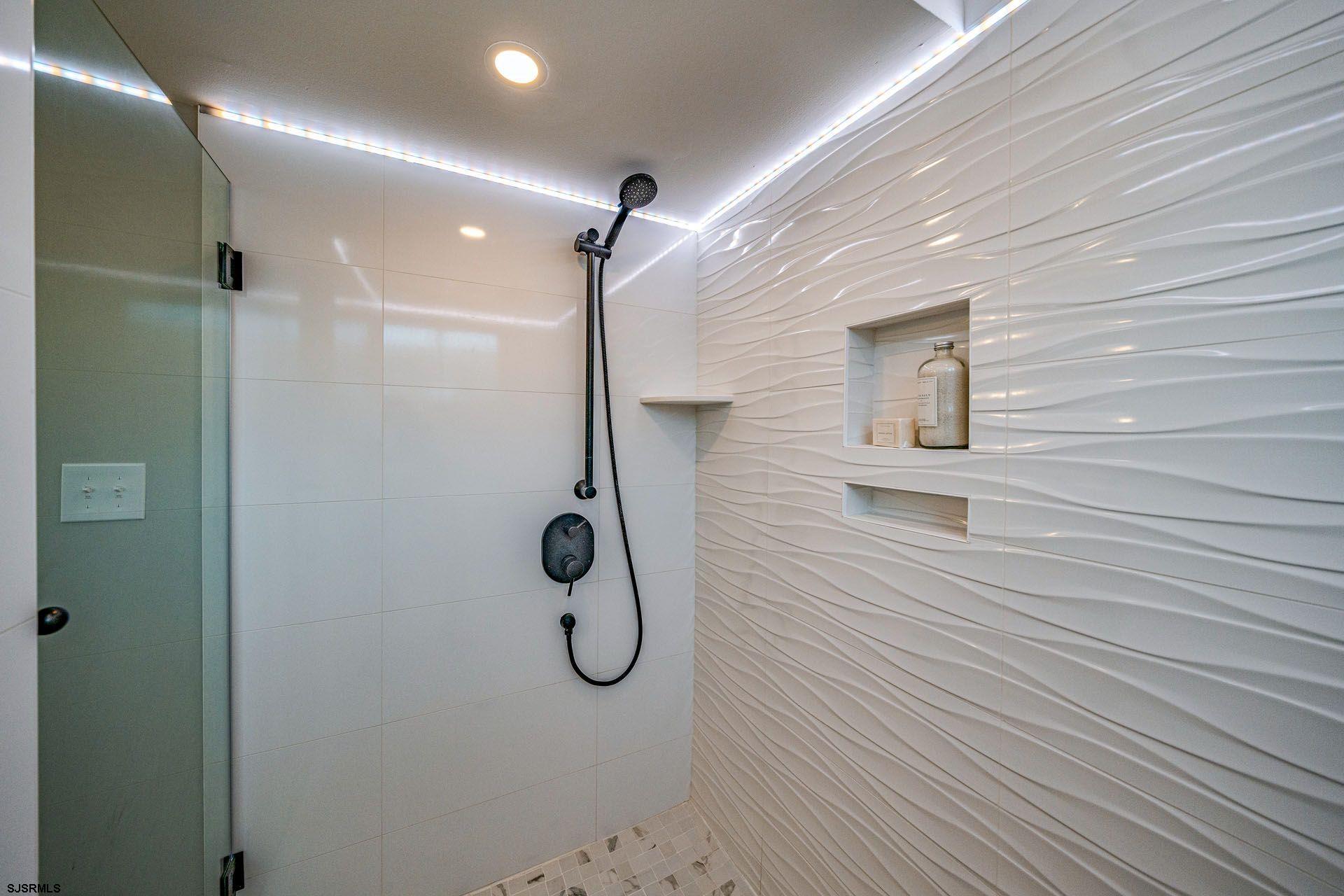 4 Wesley Road Ocean City, NJ 08226 - Photo 18 of 44 a bathroom with a shower