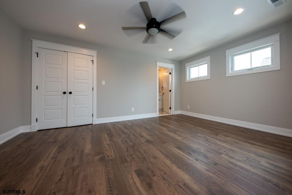 4 Wesley Road Ocean City, NJ 08226 - Photo 21 of 44 a view of an empty room with a window and wooden floor