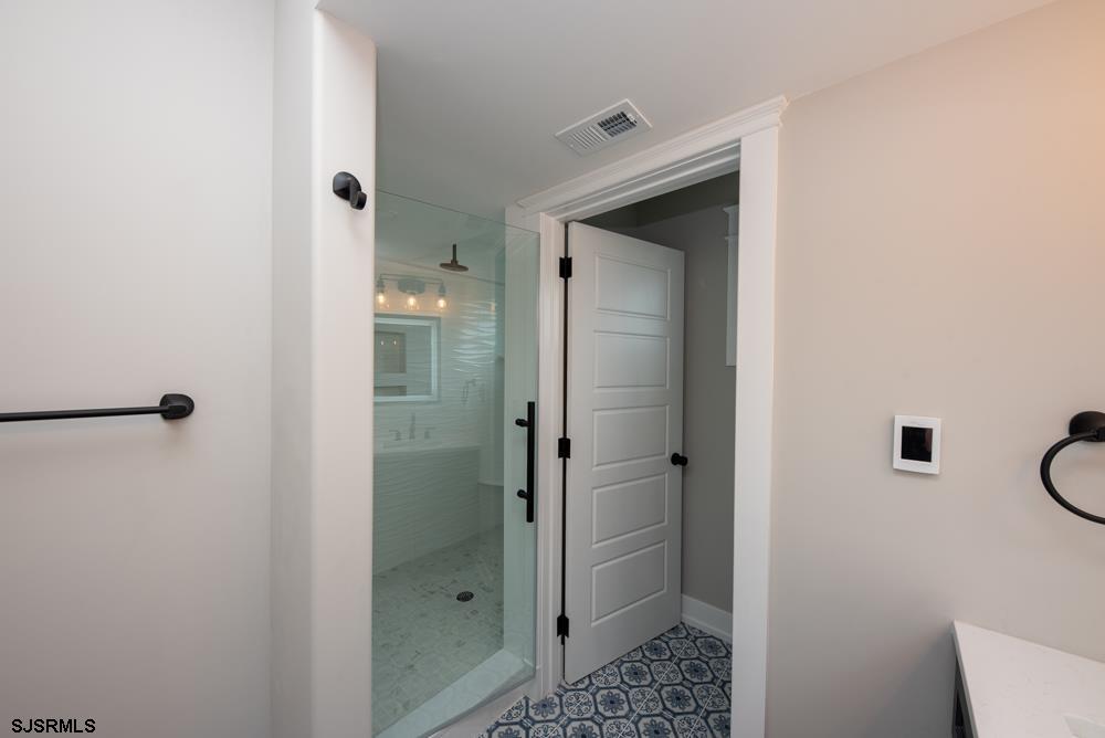 4 Wesley Road Ocean City, NJ 08226 - Photo 24 of 44 a bathroom with a shower and a sink