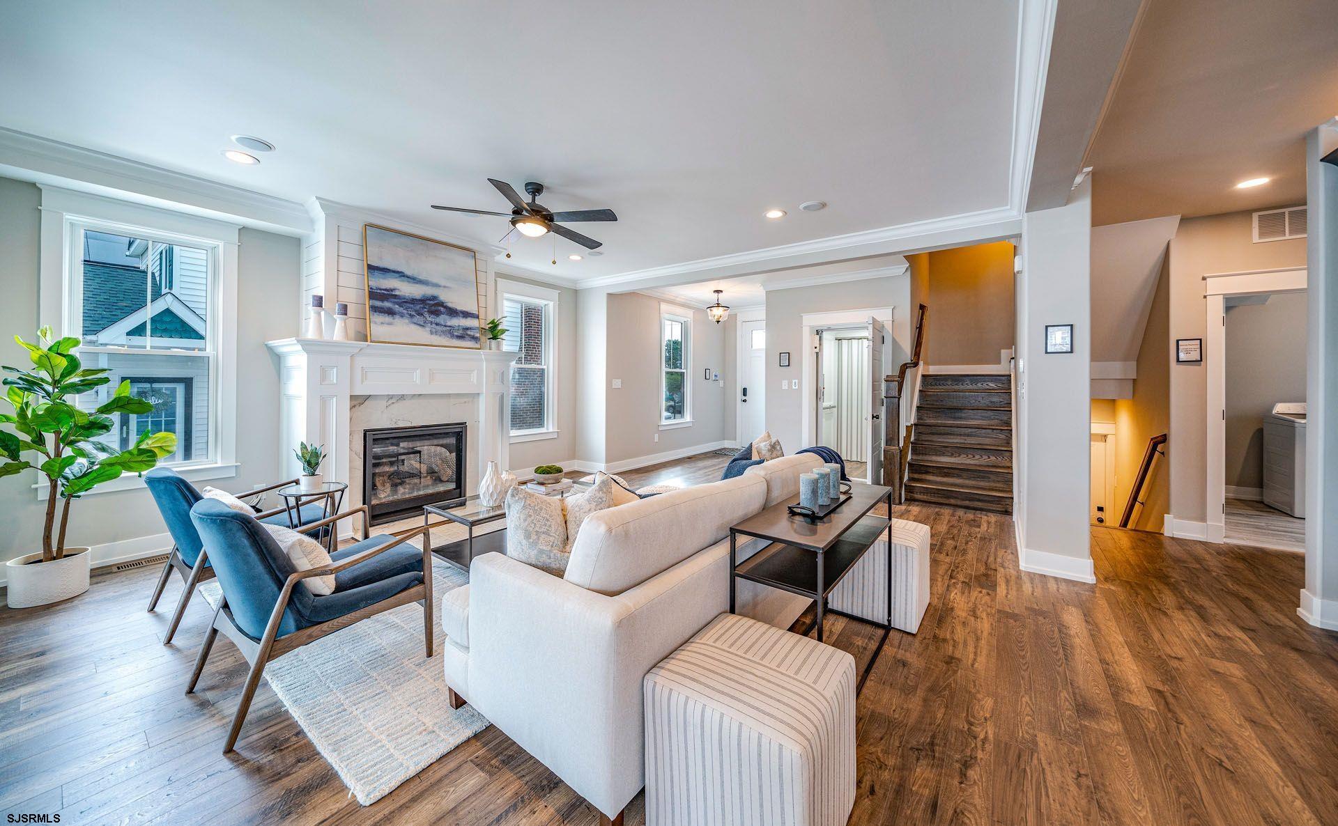 4 Wesley Road Ocean City, NJ 08226 - Photo 3 of 44 a living room with furniture and a fireplace