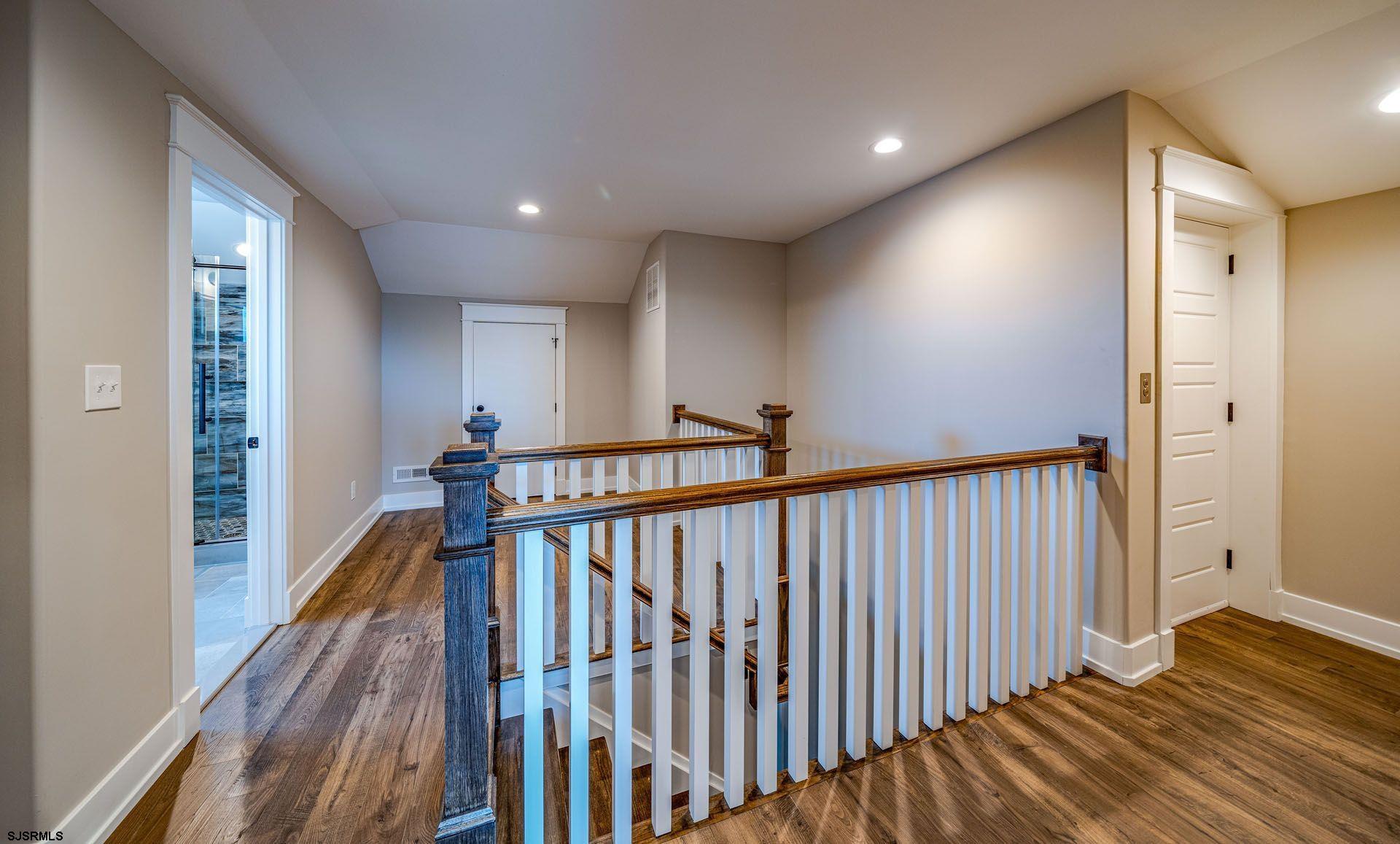 4 Wesley Road Ocean City, NJ 08226 - Photo 34 of 44 a view of a hallway with wooden floor and staircase