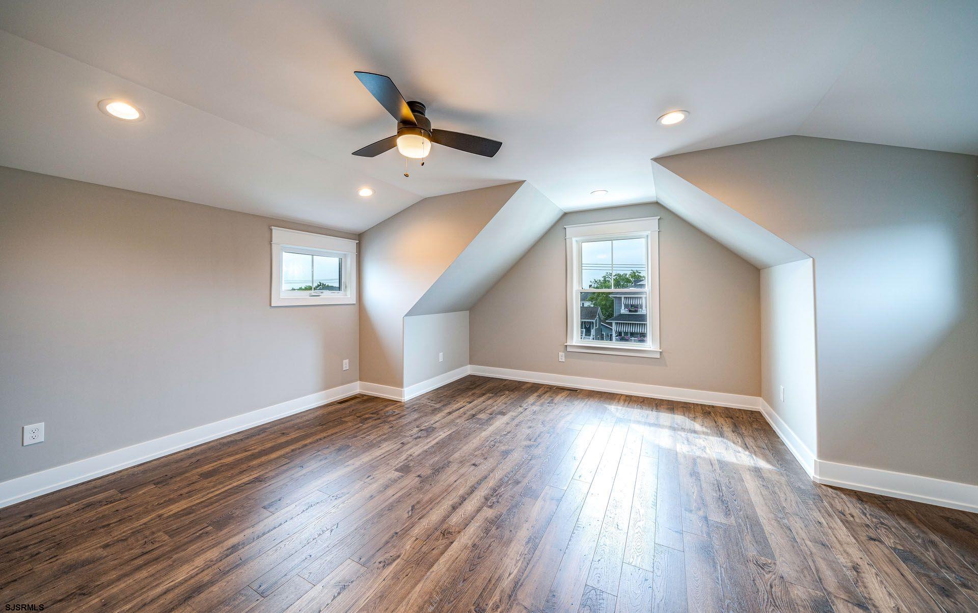 4 Wesley Road Ocean City, NJ 08226 - Photo 37 of 44 a view of an empty room with wooden floor and a window
