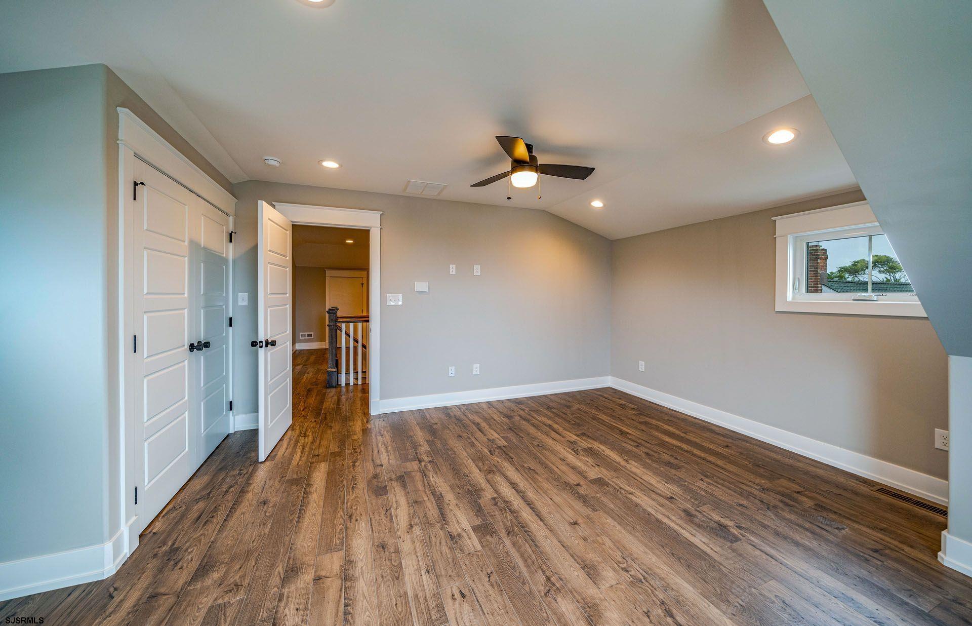 4 Wesley Road Ocean City, NJ 08226 - Photo 38 of 44 wooden floor in an empty room with a window