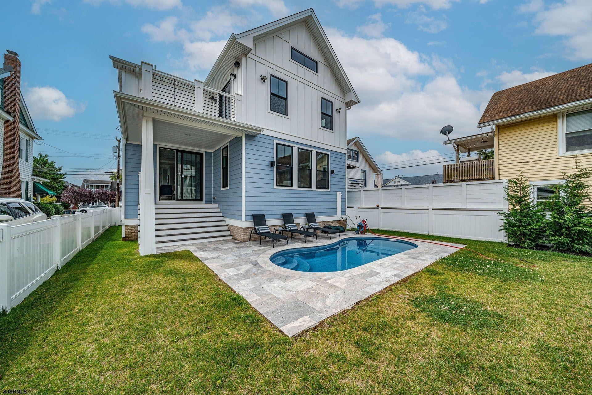 4 Wesley Road Ocean City, NJ 08226 - Photo 39 of 44 a front view of house with yard and outdoor seating