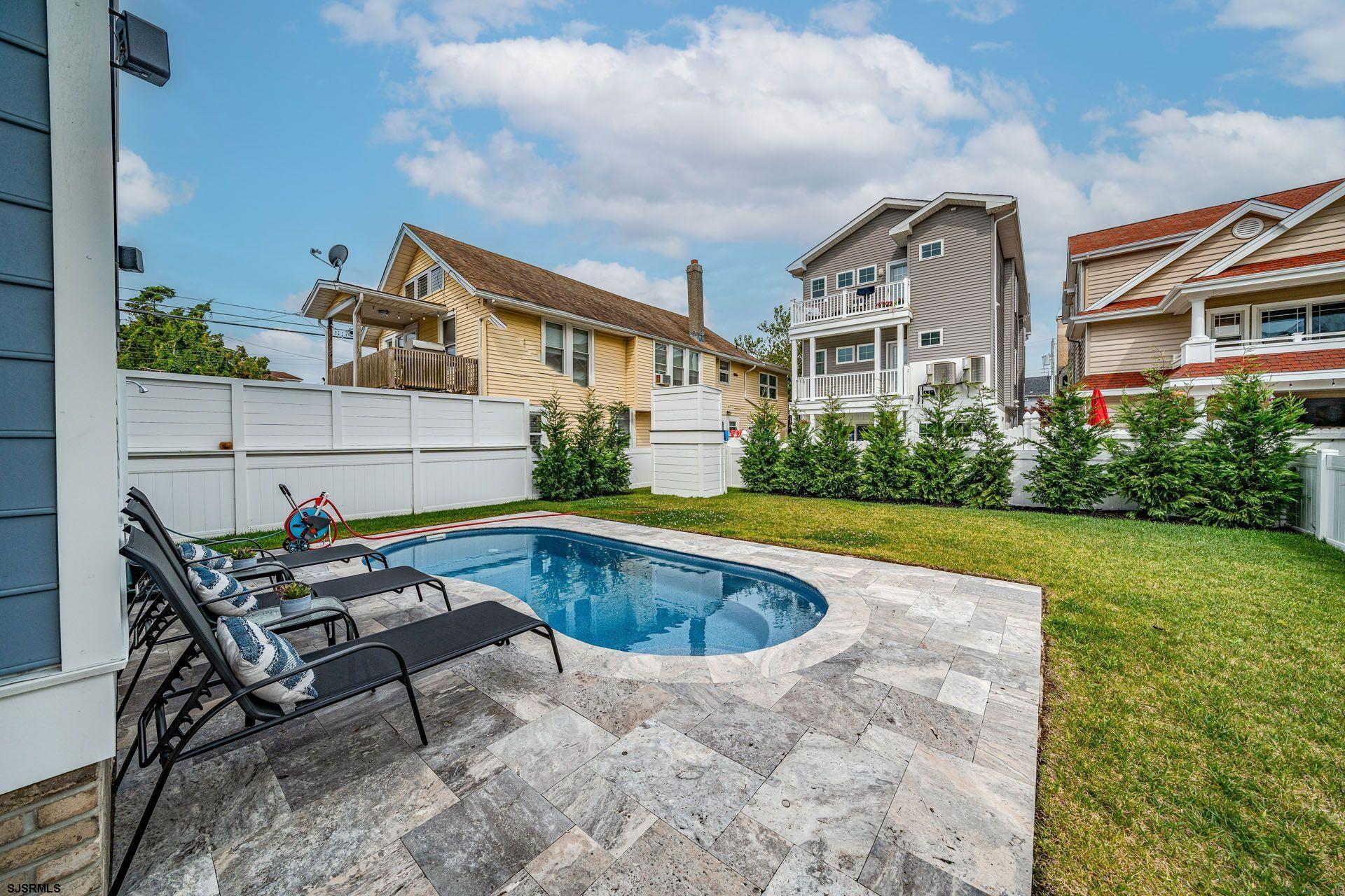 4 Wesley Road Ocean City, NJ 08226 - Photo 41 of 44 a view of house with swimming pool yard and outdoor seating