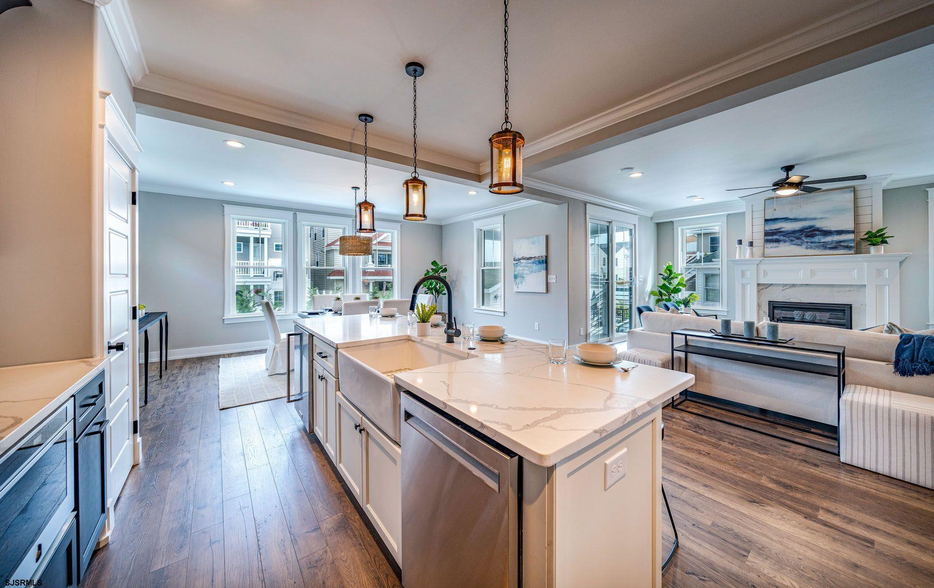 4 Wesley Road Ocean City, NJ 08226 - Photo 6 of 44 a large kitchen with kitchen island a large island in it