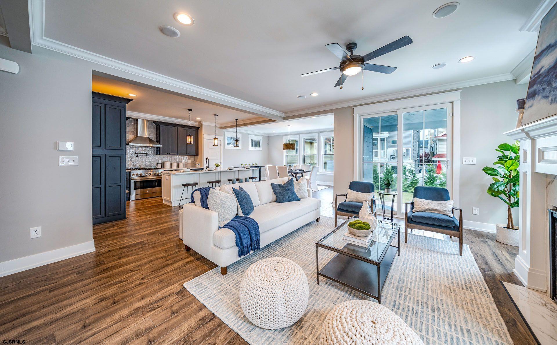 4 Wesley Road Ocean City, NJ 08226 - Photo 7 of 44 a living room with furniture and a large window