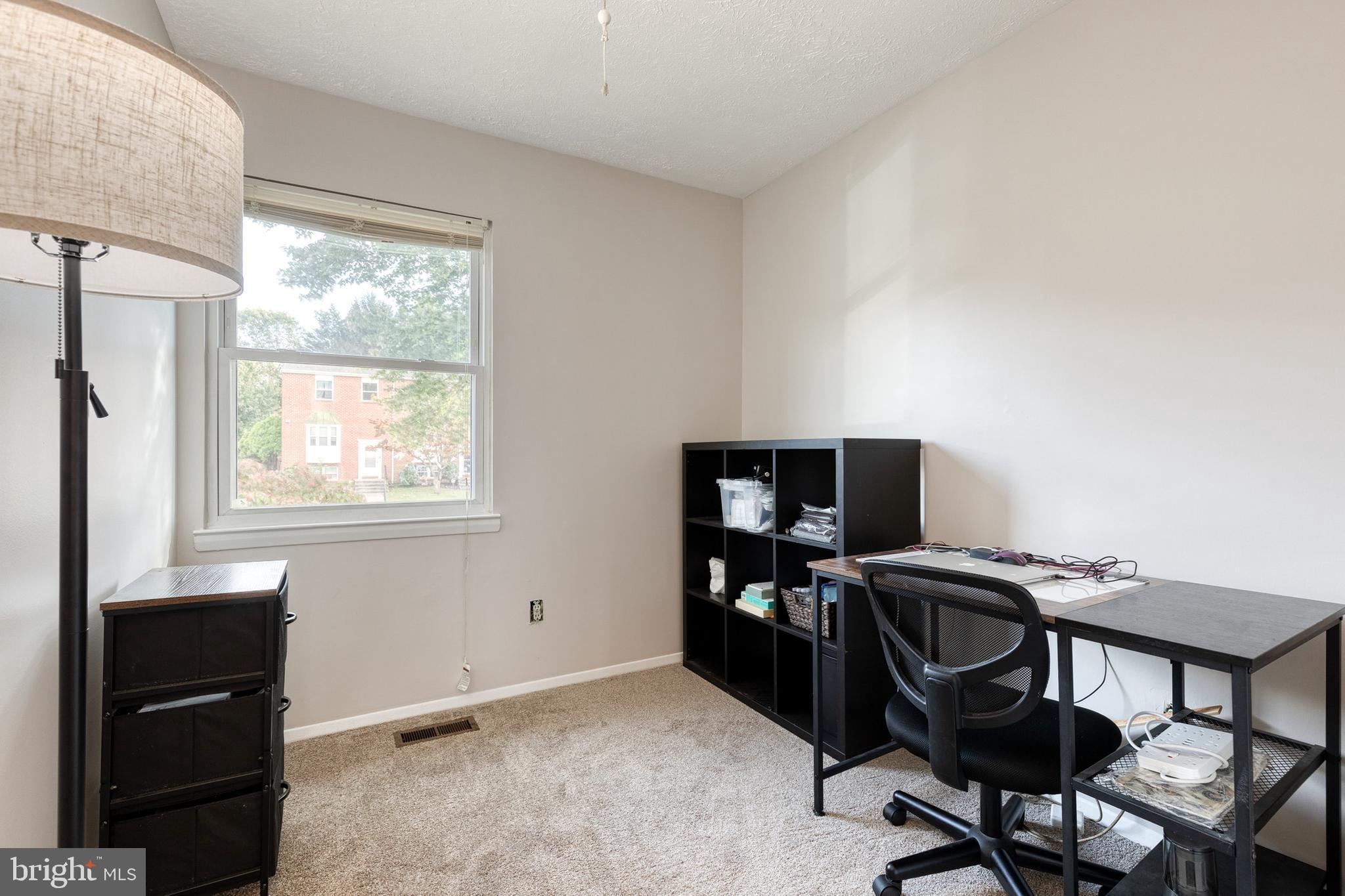 44 Perryfalls Place Baltimore, MD 21236 - Photo 15 of 19 a view of a workspace with furniture and a window