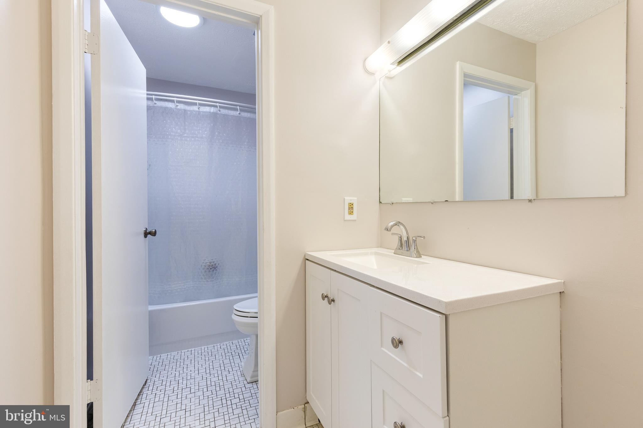 44 Perryfalls Place Baltimore, MD 21236 - Photo 18 of 19 a bathroom with a sink a toilet and shower