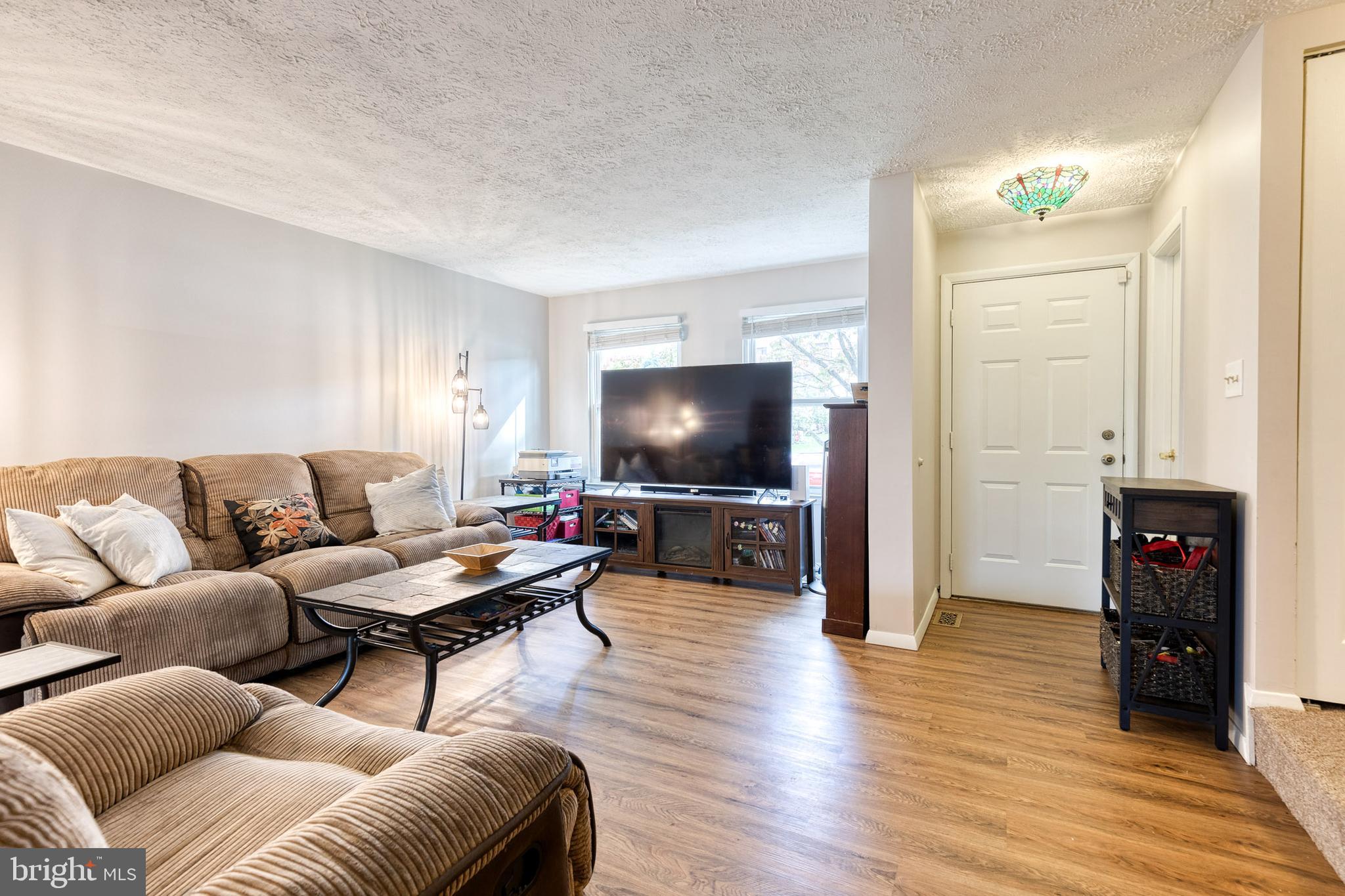 44 Perryfalls Place Baltimore, MD 21236 - Photo 5 of 19 a living room with furniture and a flat screen tv