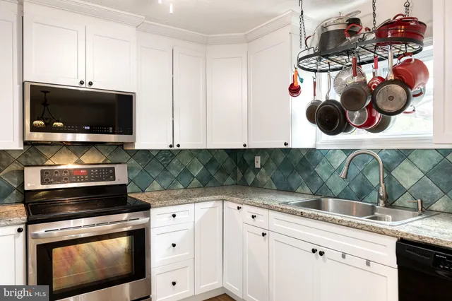 a kitchen with a stove and a microwave