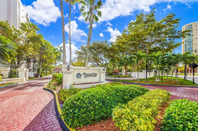 a sign board with street view