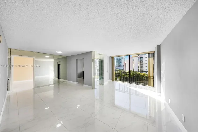 a view of an empty room with a window