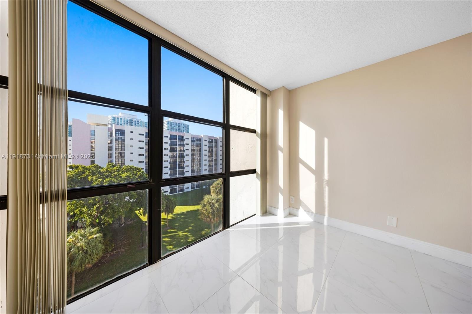 17011 North Bay Road, Unit 718 Sunny Isles Beach, FL 33160 - Photo 12 of 24 a view of an empty room with a window