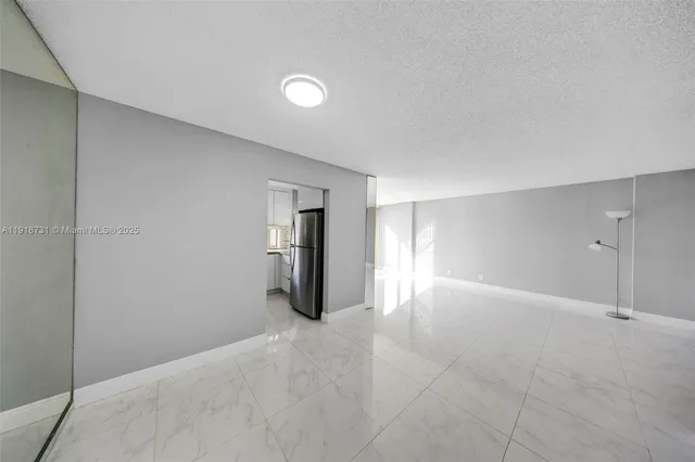 a kitchen with granite countertop cabinets stainless steel appliances and a sink