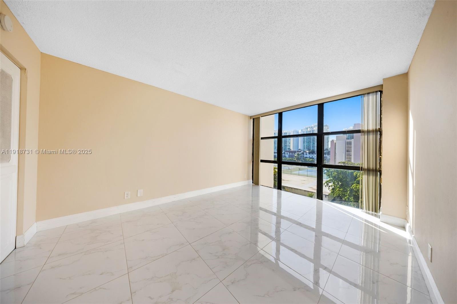 17011 North Bay Road, Unit 718 Sunny Isles Beach, FL 33160 - Photo 20 of 24 an empty room with windows