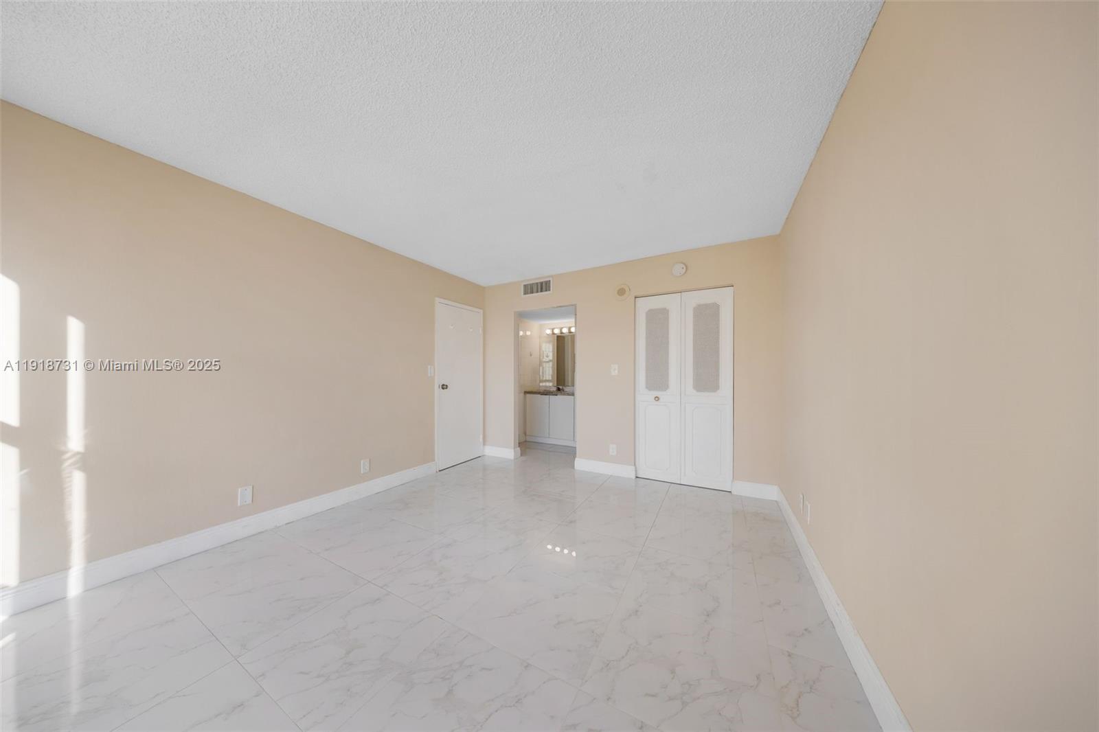 17011 North Bay Road, Unit 718 Sunny Isles Beach, FL 33160 - Photo 22 of 24 a view of an empty room with a window