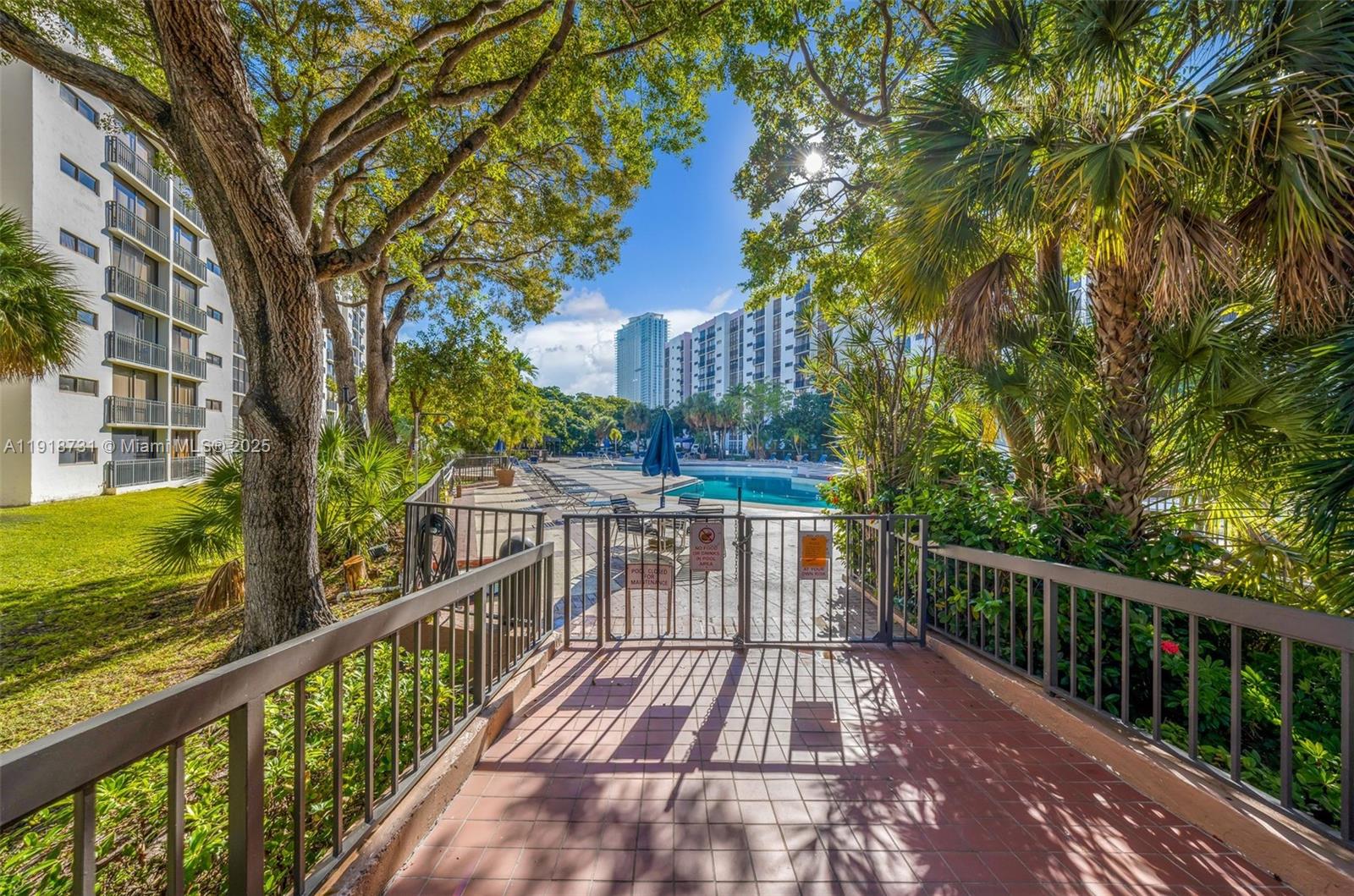 17011 North Bay Road, Unit 718 Sunny Isles Beach, FL 33160 - Photo 3 of 24 a view of a balcony with wooden floor and fence
