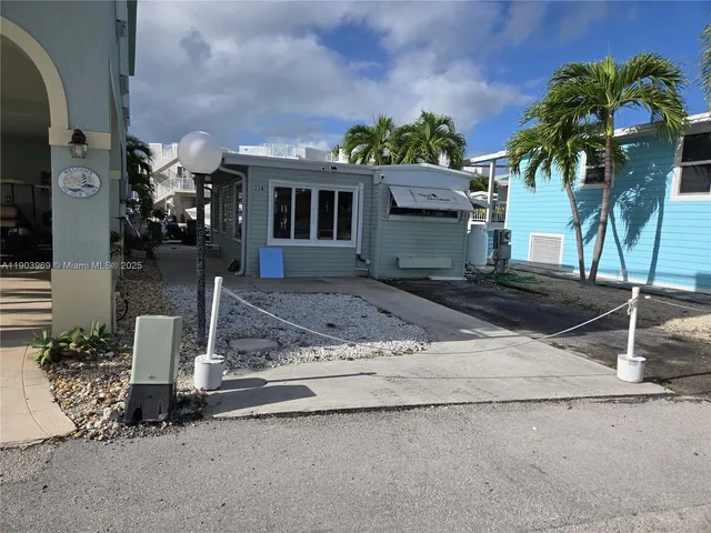 a aerial view of a house with a yard