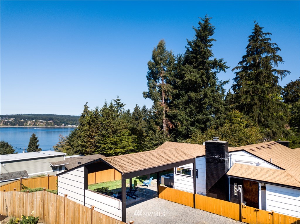 4401 Sunset Beach Road West University Place, WA 98466 - Photo 1 of 40 an aerial view of a house having yard