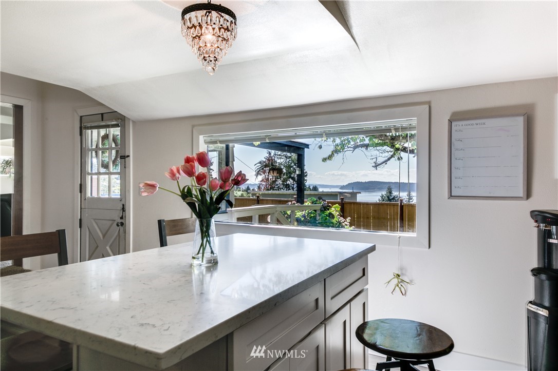4401 Sunset Beach Road West University Place, WA 98466 - Photo 22 of 40 a view of kitchen with a sink and a chandelier