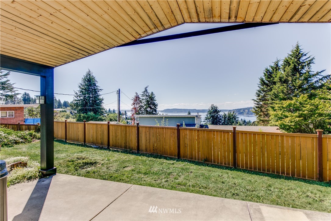 4401 Sunset Beach Road West University Place, WA 98466 - Photo 8 of 40 a view of a backyard with wooden fence